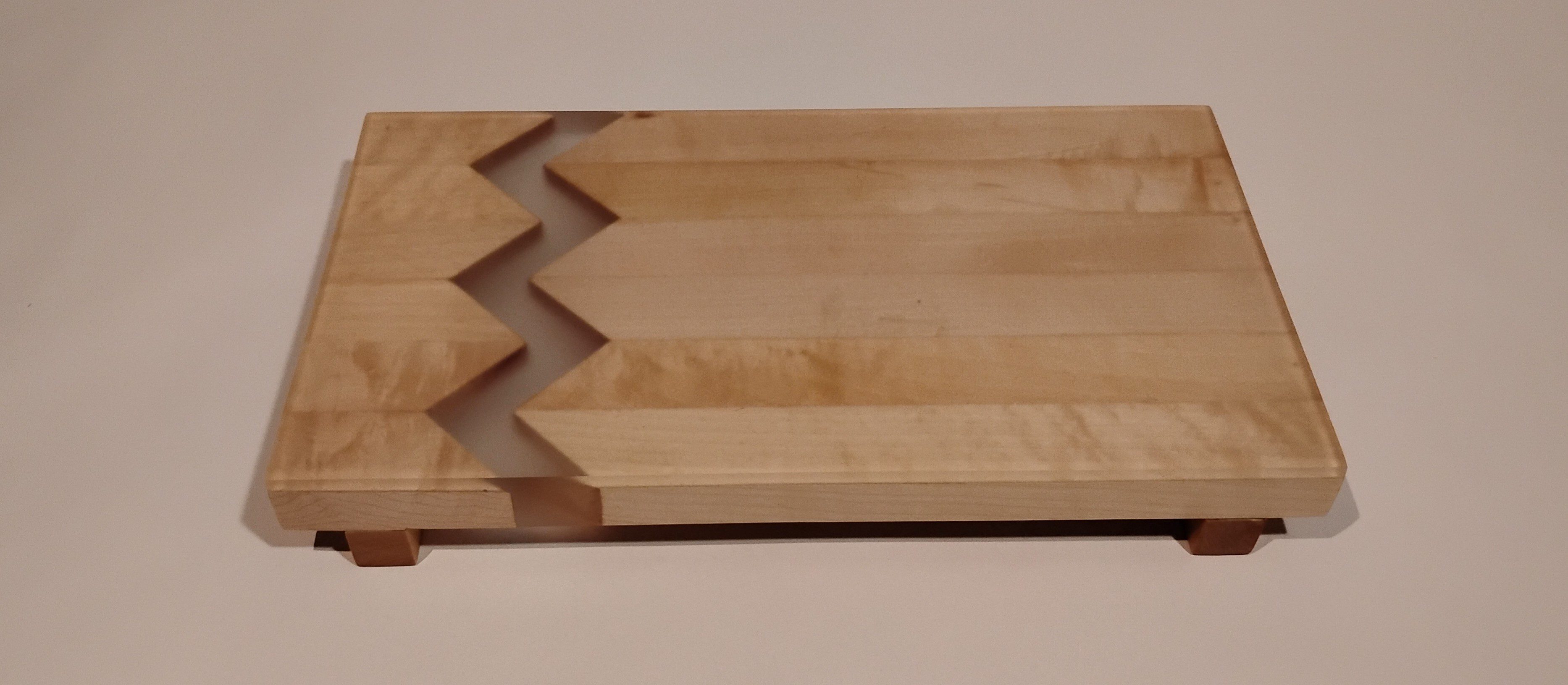 Close-up of wooden boards with zigzag edges for finger jointing.