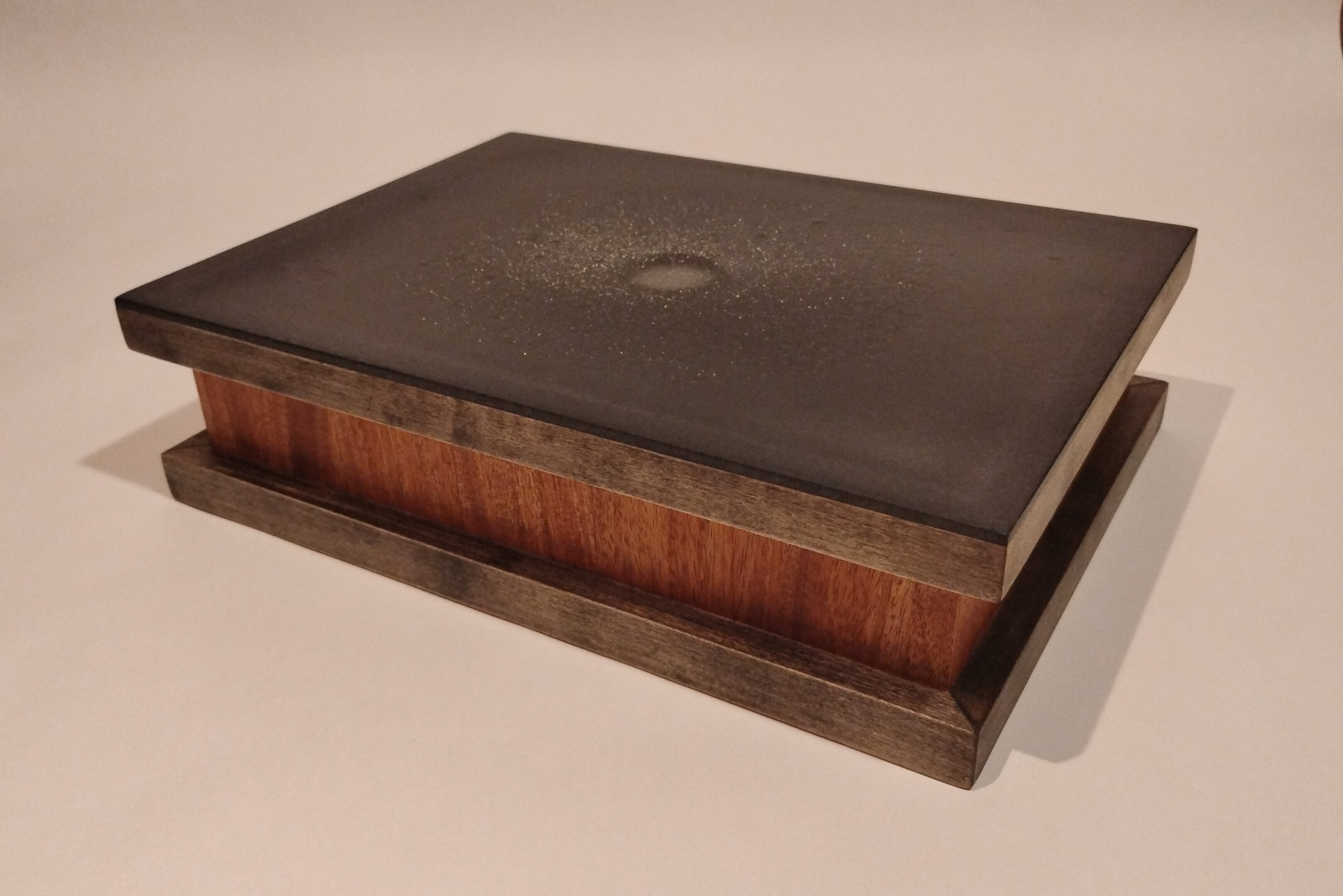 A vintage wooden and leather book press.
