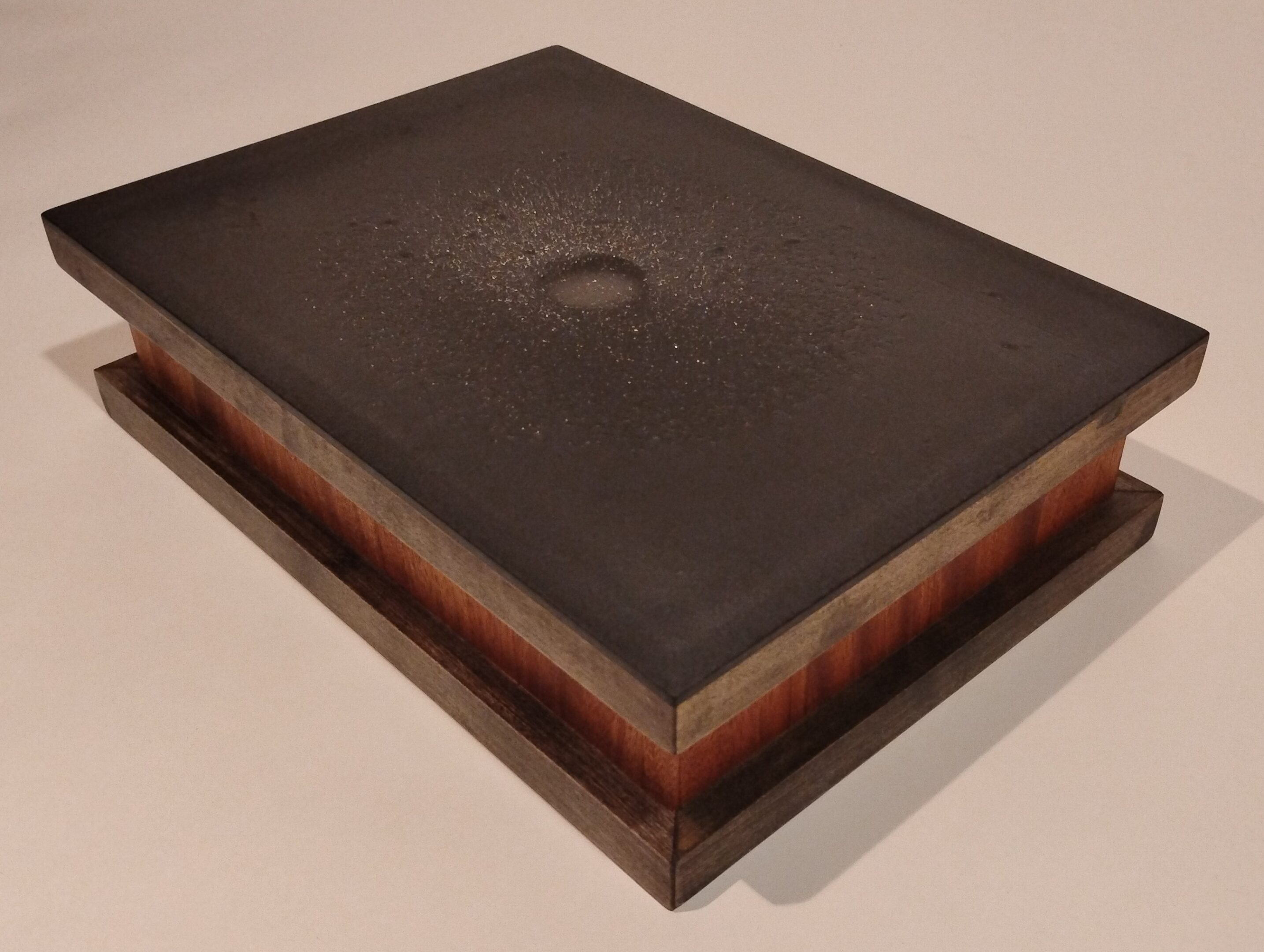 Thick, old book with a dark, worn cover and visible pages.