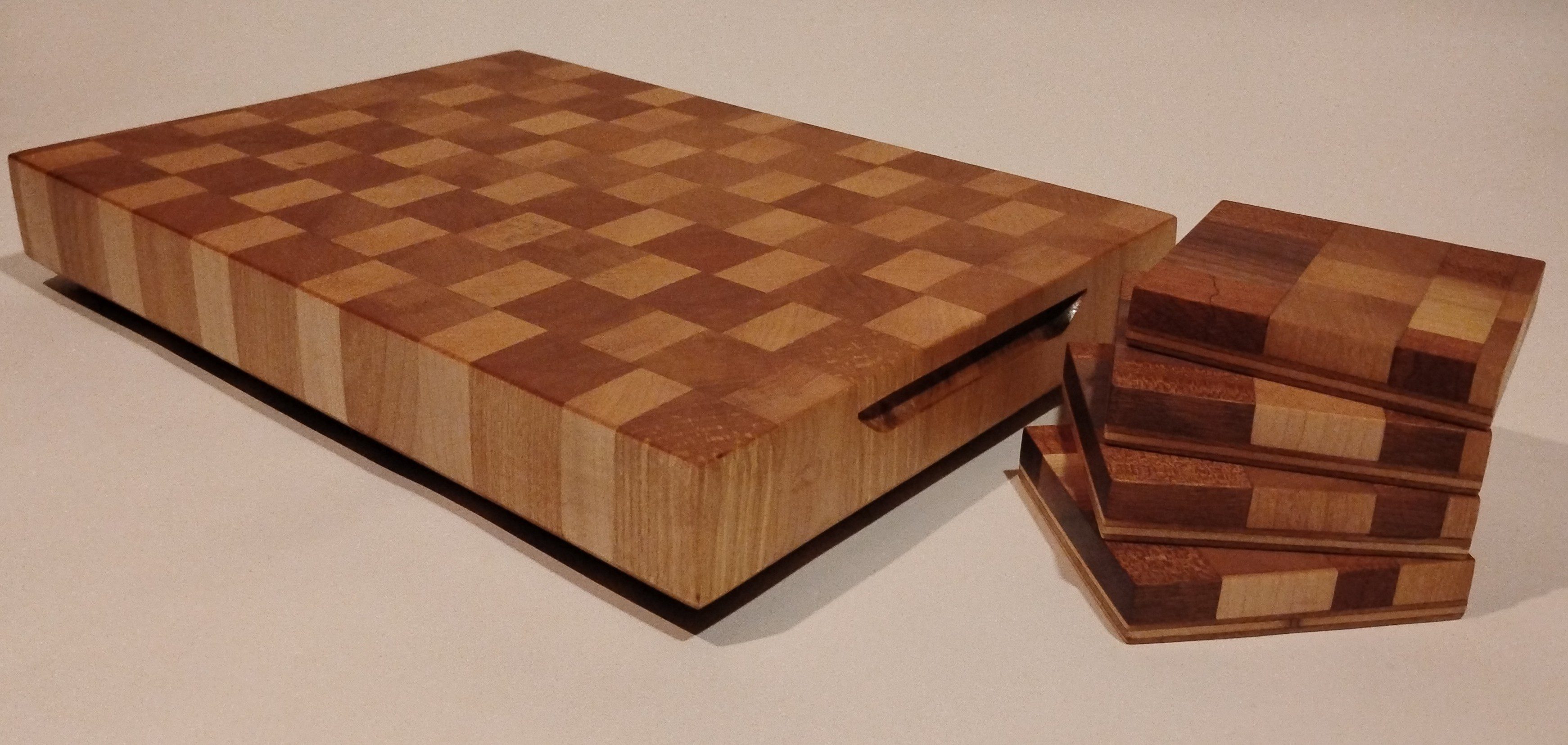A wooden checkerboard with pieces set for a game.