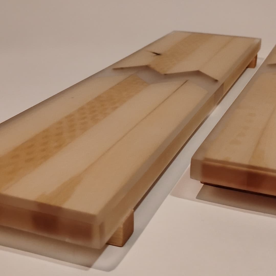 Close-up of wooden blocks with a smooth finish and layered design.