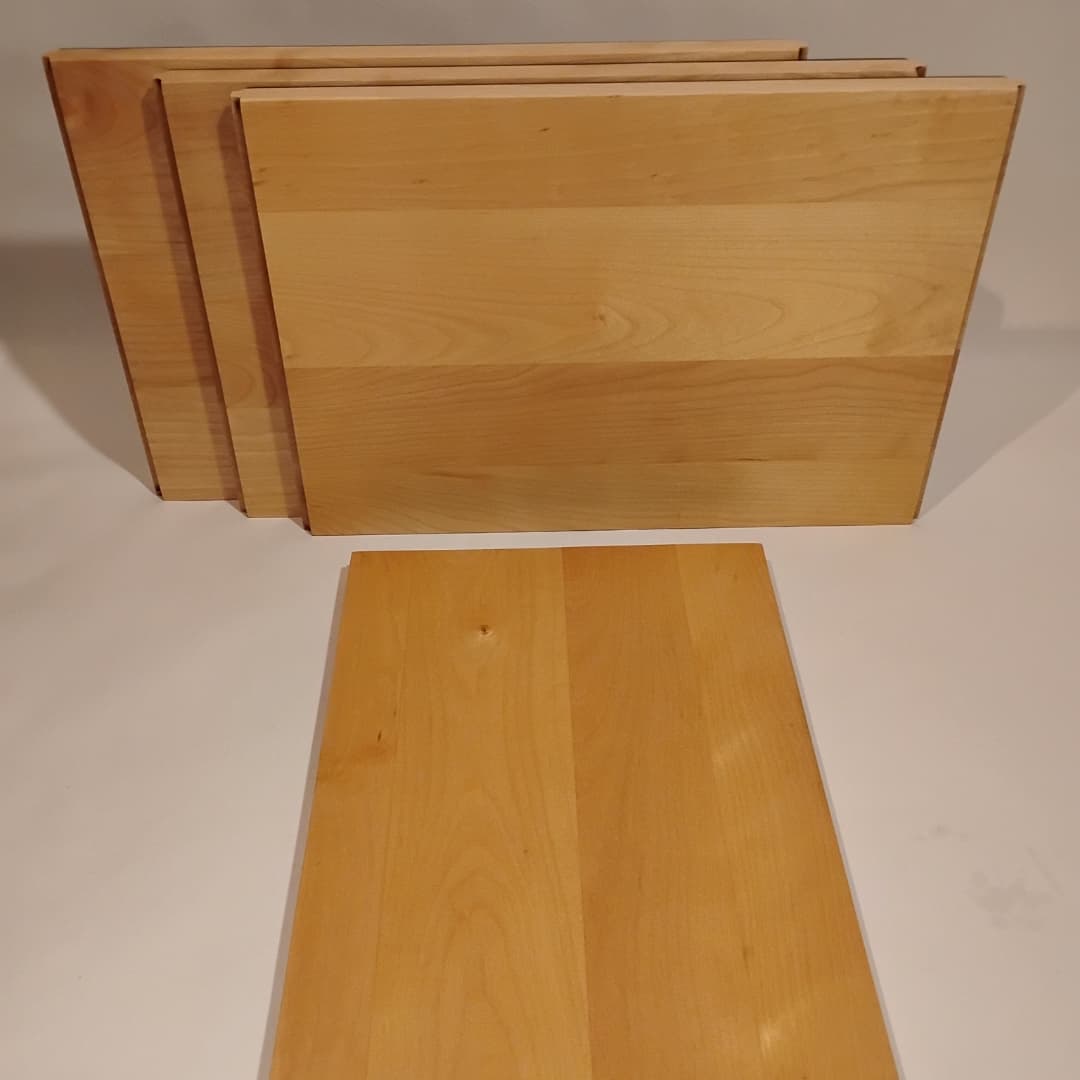 Set of vintage wooden cutting boards with a simple design.